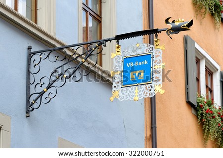 ROTHENBURG OB DER TAUBER, GERMANY - AUGUST 10, 2015: A wrought iron hanging sign of the VR - Bank.