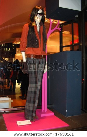 A mannequin on a shop-window displaying the latest fashion