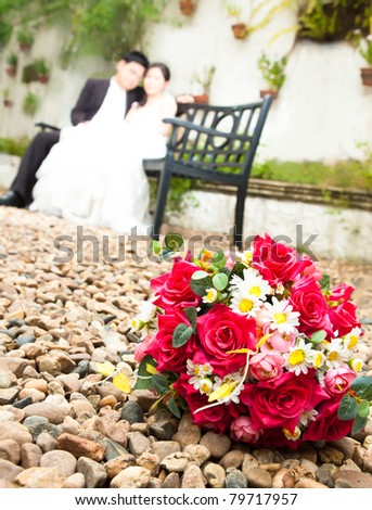 Flowers with bride and groom