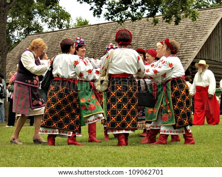 JEKABPILS, LATVIA - JULY 14: unknown women group dancing in national clothes at the Song Festival - Chervona Kalina VI on July 14, 2012 in Selu seta, Jekabpils, Latvia