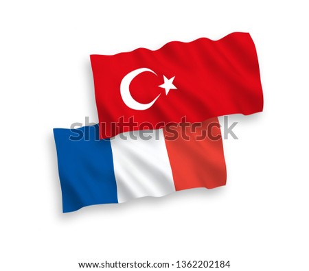 National vector fabric wave flags of Turkey and France isolated on white background. 1 to 2 proportion.