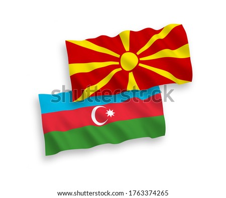 National vector fabric wave flags of Azerbaijan and North Macedonia isolated on white background. 1 to 2 proportion.