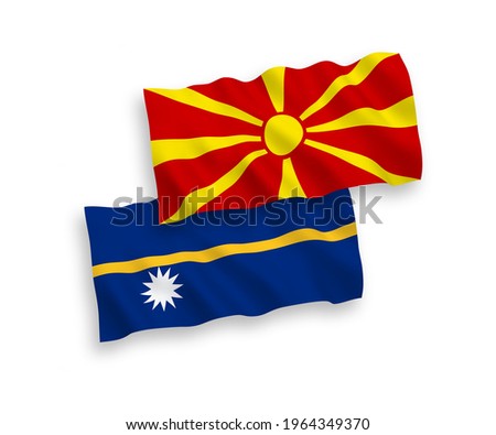 National vector fabric wave flags of Republic of Nauru and North Macedonia isolated on white background. 1 to 2 proportion.