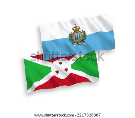 National vector fabric wave flags of San Marino and Burundi isolated on white background. 1 to 2 proportion.