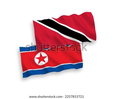 National vector fabric wave flags of North Korea and Republic of Trinidad and Tobago isolated on white background. 1 to 2 proportion.