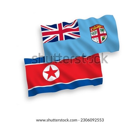 National vector fabric wave flags of North Korea and Republic of Fiji isolated on white background. 1 to 2 proportion.