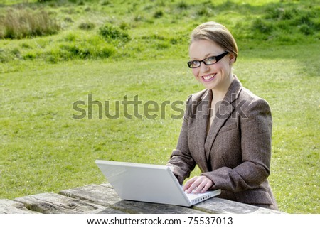 businesswoman with laptop enjoy works wireless outdoor green meadow behind