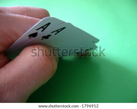 pair aces (spade and club) on green background...