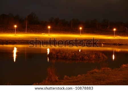 lamps and reflection light in pond, night scenery