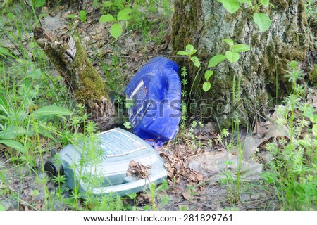 MOSCOW REGION - MAY 23: Trash in the forest on May 23, 2011, in Moscow region. People pollute the environment, plastic containers in the forest