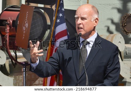 HOLLYWOOD, CA - SEPTEMBER 18, 2014: California Governor Jerry Brown gestures as he speaks at the signing of the California Film and Television Job Retention Act in Hollywood, CA on September 18, 2014.