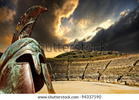 a concept image for ancient greece featuring the amphitheatre  at philippi and an overlaid replica war helmet