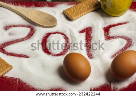 2015 sign draw in the sugar with food, eggs, cookies, biscuits, culinary, art, photo in landscape format perfect for a food blog