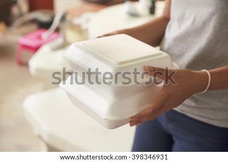 Similar – Image, Stock Photo Styrofoam box with food from snack bar on shimmering satin bed sheet