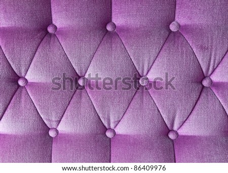 Texture of purple fabric vintage sofa for background