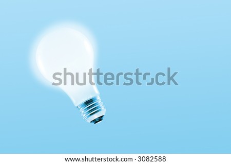 Glowing light bulb on a light blue background