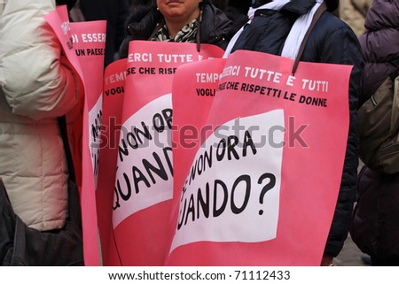 TURIN, ITALY- FEBRUARY 13: demonstration against Berlusconi, politics corruption,  for women rights, on February, 13, 2011. During the event there has been a flash mob with umbrellas and balls of wool