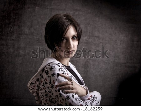 Serious lady portrait on the grunge background - soft focus