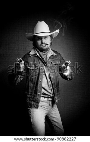 Cowboy in white hat with two toy guns and cigar