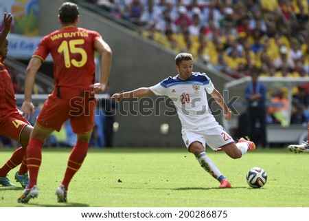 RIO DE JANEIRO, BRAZIL - June 22, 2014: Daniel VAN BUYTEN of Belgium and Victor FAYZULIN of Russia compete for the ball during the World Cup Group H game between Belgium and Russia at Maracana Stadium.