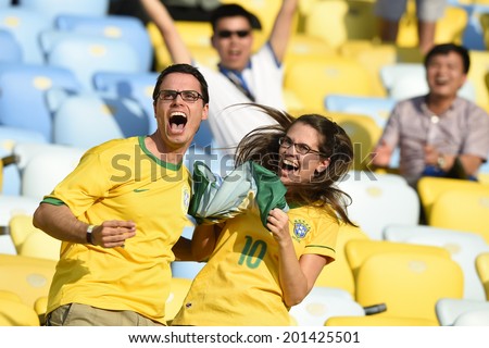 RIO DE JANEIRO, BRAZIL - June 28, 2014: Soccer fans celebrating at the 2014 World Cup Round of 16 game between Colombia and Uruguay at Maracana Stadium.