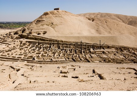 The ruins of the ancient Egyptian workers\' village Deir el Medina on the West Bank of the Nile at Luxor, Egypt. Ancient ruin, over 1000 years old.