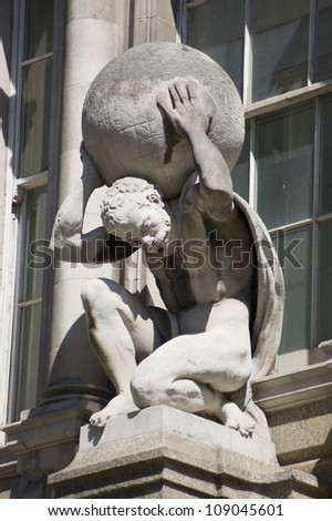 Statue of the mythological Atlas, carrying the globe on his back. Sculpted by the now defunct Farmer & Brindley works, on public display since 1894.   Viewed from public pavement, City of London.