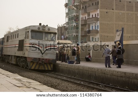 EL BALYANA, SOHAG, EGYPT - JANUARY 8: Passengers waiting for the train to Cairo on January 8 2012.  The railway service provides vital transport but is increasingly unreliable due to funding problems.