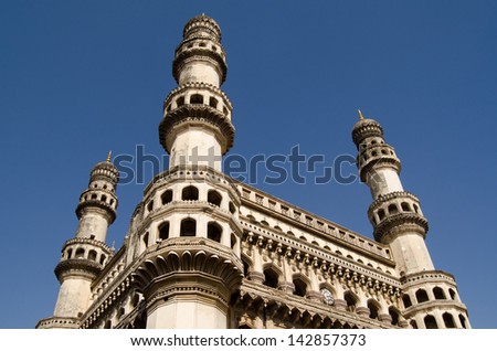 View of the landmark Charminar tower in central Hyderabad, India.   Islamic architecture built during the Mughal Empire and housing a mosque it is one of the most well known landmarks in the city.