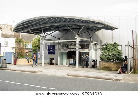 LONDON, ENGLAND - MARCH 15, 2014: Students outside the entrance to the Acton Campus of the Ealing, Hammersmith & West London College.