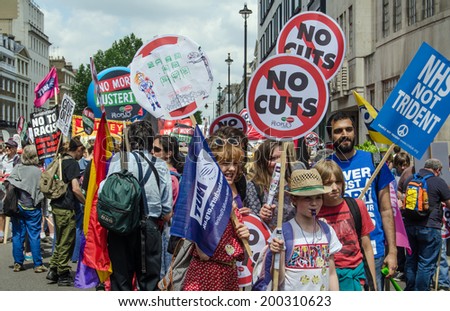 LONDON, ENGLAND - JUNE 21, 2014: Protesters campaigning against the Coalition Government gathering in central London before taking part in the People\'s Assembly march through central London.