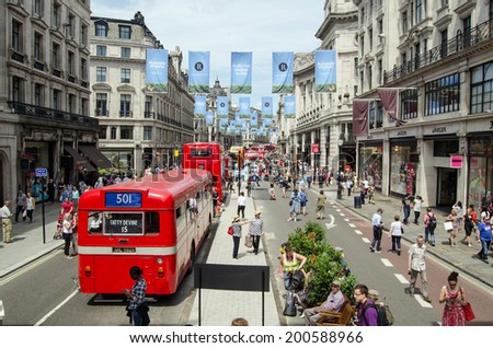 LONDON, ENGLAND - JUNE 22, 2014: View from the top of a double decker bus of the cavalcade of buses along Regent Street, Westminster, celebrating the bicentenary of London buses.