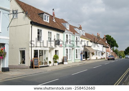 ALRESFORD, HAMPSHIRE, UK - SEPTEMBER 13, 2014:  Historic shops and houses on East Street in the pretty Hampshire town of Alresford.