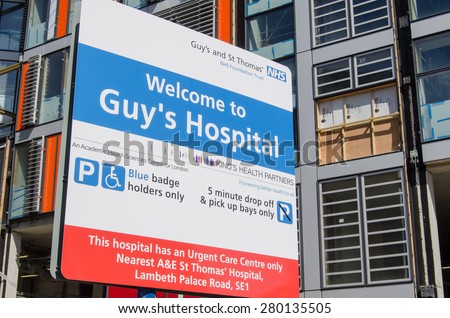LONDON, UK - APRIL 12, 2015:  A sign at Guy\'s Hospital in Southwark, inner London.  The National Health Service hospital has many new buildings and is a centre of excellence for healthcare.