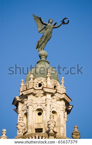Allegorical statue of the Ancient Greek goddess Nike (known to the Romans as Victoria or Victory.  Roof of the Gran Teatro, Havana.