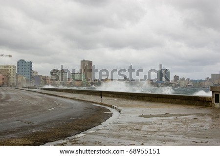 View of the Malecon road which skirts the corniche of Havana Bay, Cuba. The Caribbean Sea is rather stormy following a hurricane.