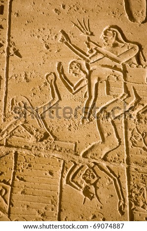Soldiers fighting a siege at the Battle of Kadesh.  Ancient Egyptian army in conflict with the Hittites.  Frieze at the Ramesseum Temple, Luxor, Egypt.