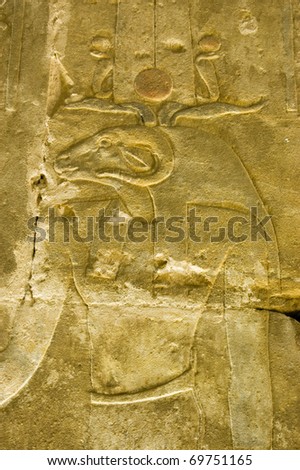 Ancient Egyptian decorated carving of the ram headed god Khnum.  Interior chapel of the Temple of Horus, Edfu, Egypt.