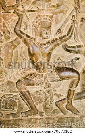 Ancient Khmer bas relief of Kauravaa soldier holding spear in the Battle of Kurukshetra.  Wall of Angkor Wat Temple, Siem Reap, Cambodia.