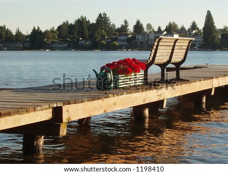 A bench on a dock by the lake