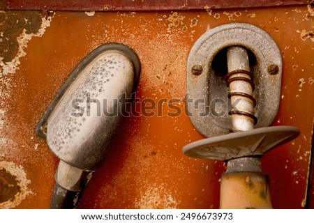 Similar – Image, Stock Photo Old dilapidated fuel pump for liquid fuel in detail with reflection of a blue oh so environmentally friendly xyz car