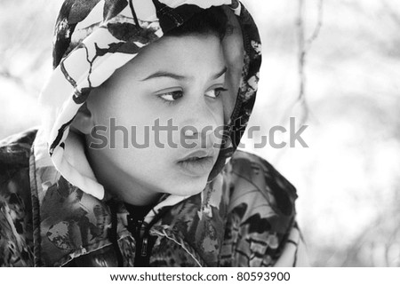 Teenage Boy In Camouflage Clothing