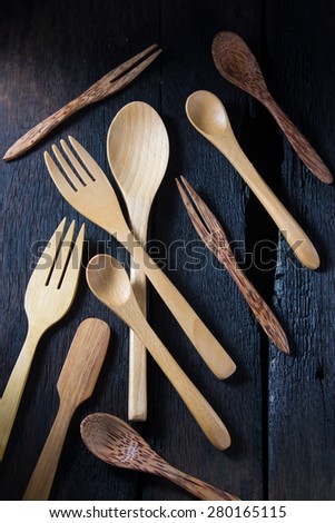 wood spoon and fork on wood background