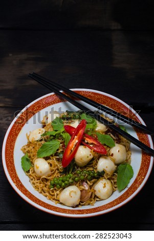 Thai style food : Instant noodle fried with spicy sauce and fish ball