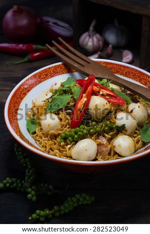 Thai style food : Instant noodle fried with spicy sauce and fish ball