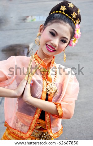 BANGKOK, THAILAND - OCTOBER 3: Thai Traditional Dress. This is the parade of making traditional merit of people from the northern territory of Thailand, October 3, 2010 in Bangkok, Thailand.