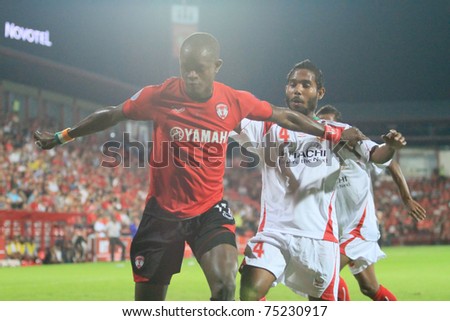 THAILAND- APRIL 12:K.Christian(red) in AFC CUP Group G between Muang Thong utd (Red) vs Victory sc (white) on April 12, 2011 at Yamaha Stadium Bkk,Thailand
