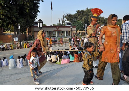 WAGAH BORDER, INDIA - 25 OCTOBER: Rich indian visitors enter the VIP ceremonial sector on indo-pakistan border on October 25, 2009. It is famous for closing the gate between both states.