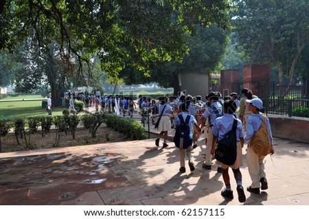 DELHI, INDIA - OCT 24: A group of pupils walk on courtyard of the Red Fort on October 24, 2009 in Delhi. The Red Fort,UNESCO World Heritage, is one of the most popular tourist destinations in Delhi.