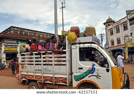 MADURAI, INDIA - NOV 7: A group of indian women travel on truck in Madurai on November 7, 2009. Unsatisfactory public transportation limits indian people in everyday traveling.